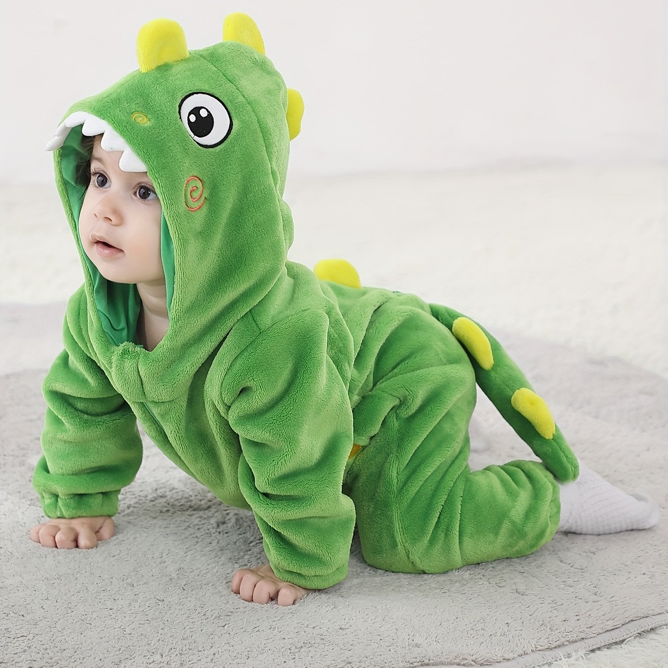 Macacão infantil fofo com capuz e mangas compridas, estampa de dinossauro de desenho animado. Ideal para festas e uso casual ao ar livre na primavera, outono e inverno.
