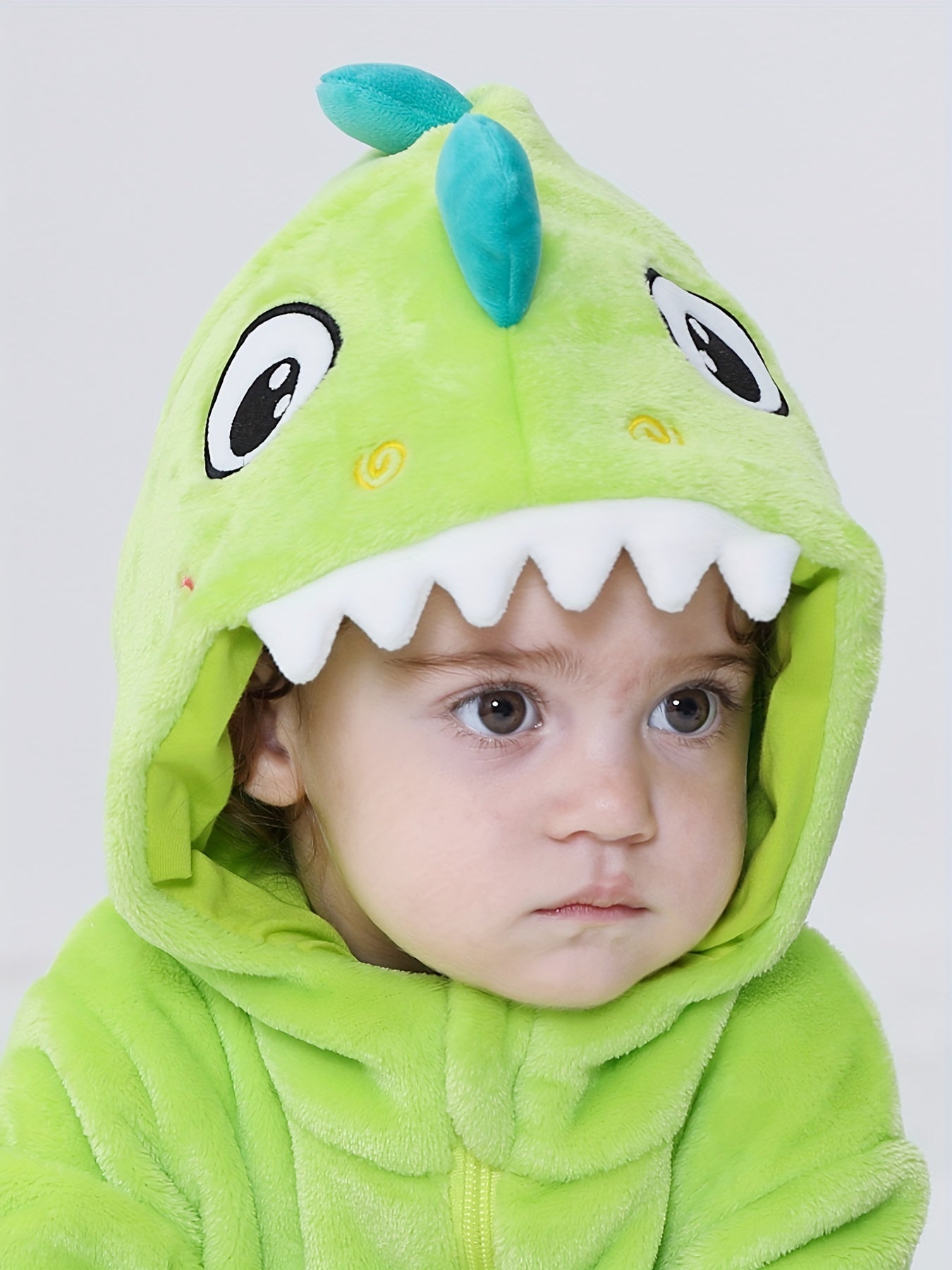Macacão infantil fofo com capuz e mangas compridas, estampa de dinossauro de desenho animado. Ideal para festas e uso casual ao ar livre na primavera, outono e inverno.