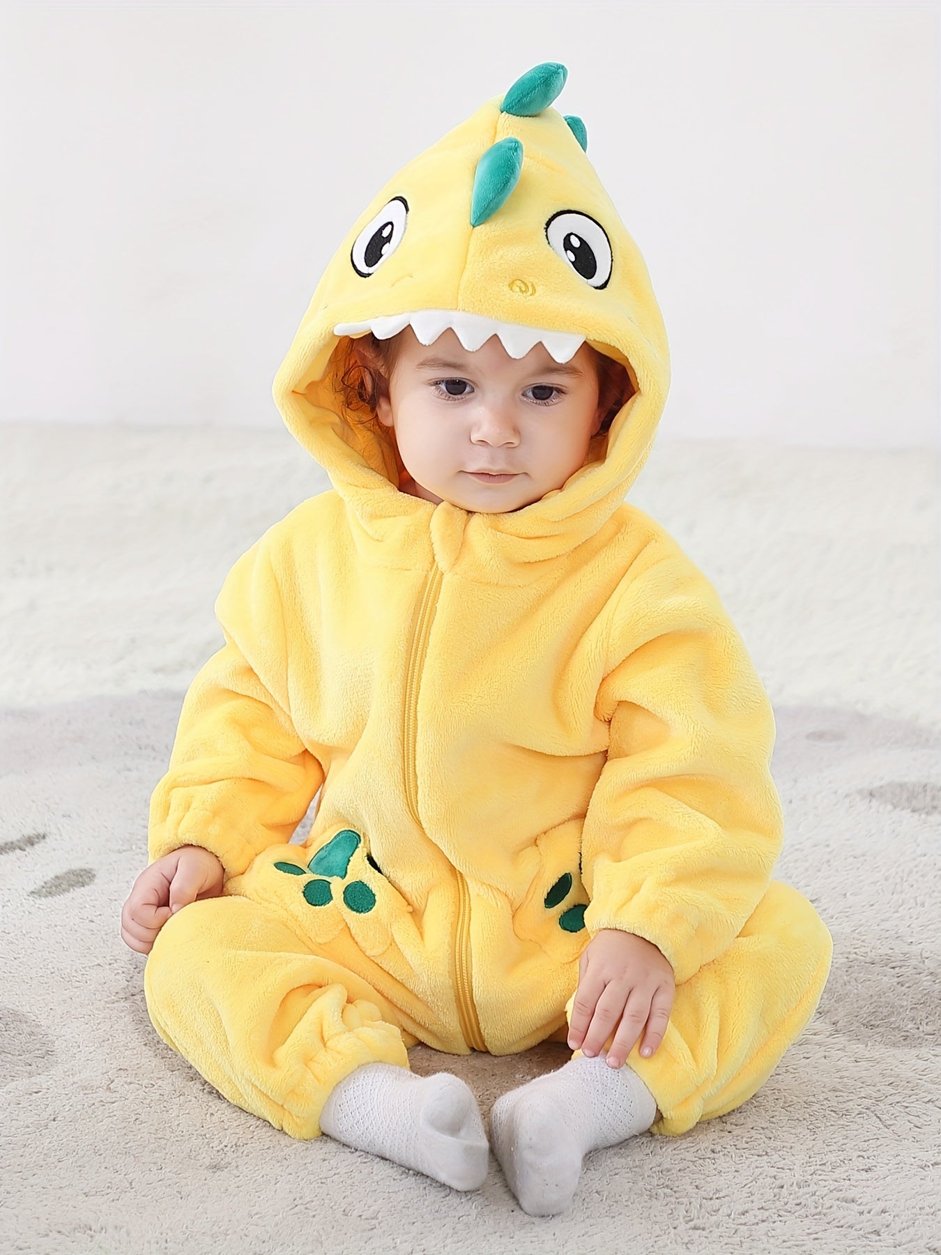 Macacão infantil fofo com capuz e mangas compridas, estampa de dinossauro de desenho animado. Ideal para festas e uso casual ao ar livre na primavera, outono e inverno.
