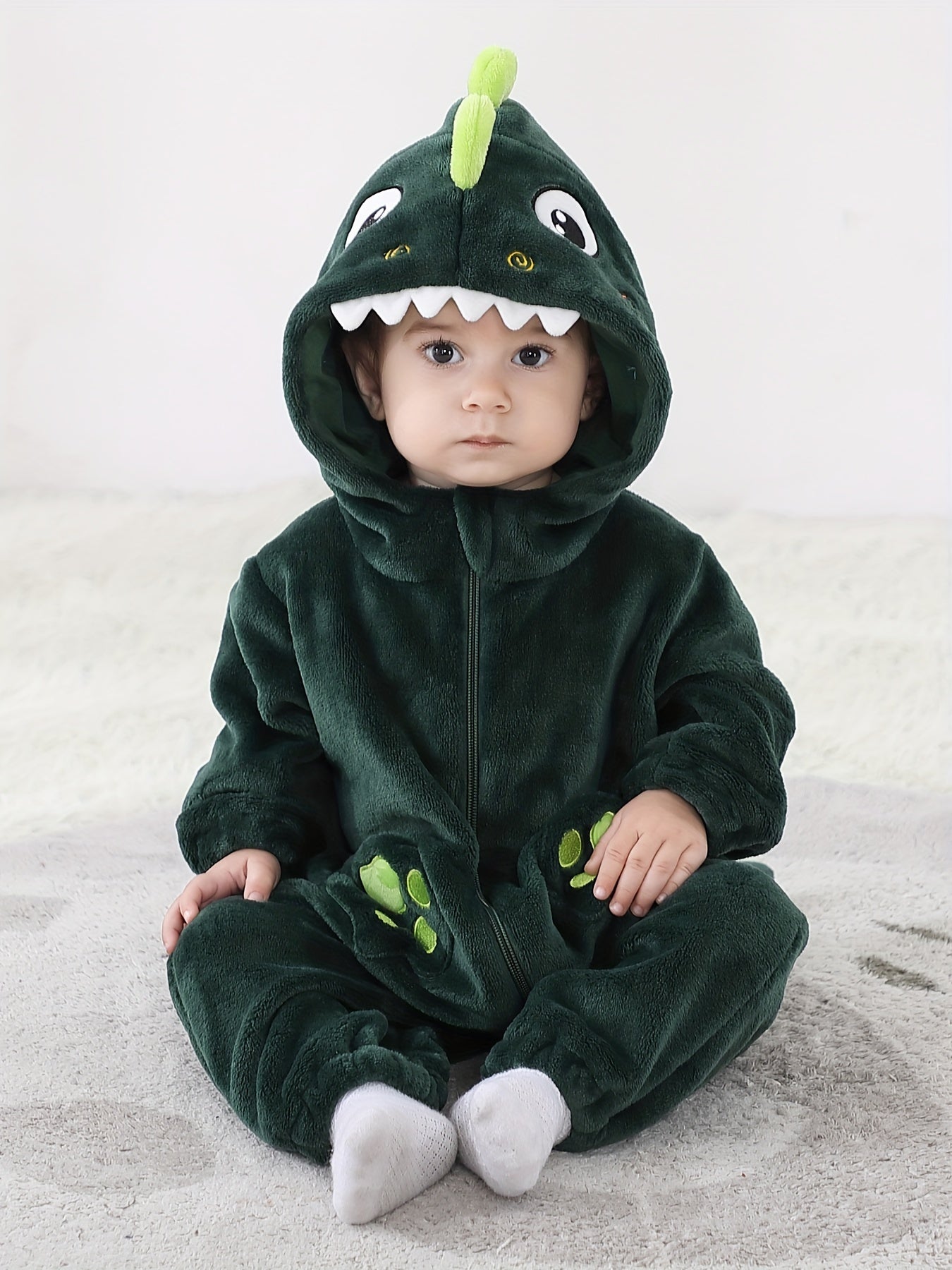 Macacão infantil fofo com capuz e mangas compridas, estampa de dinossauro de desenho animado. Ideal para festas e uso casual ao ar livre na primavera, outono e inverno.