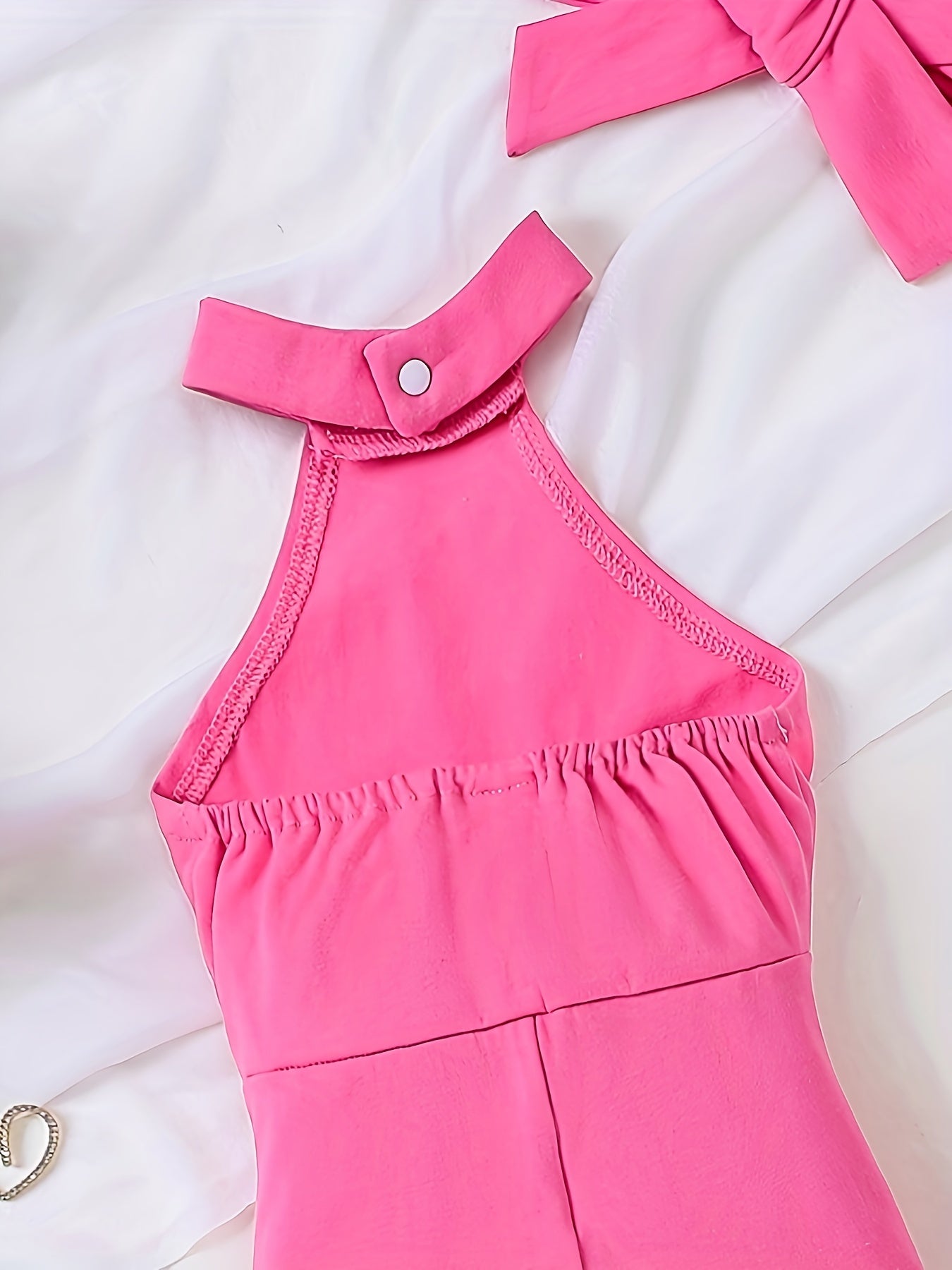 Macacão infantil feminino estiloso com decote halter e pernas largas